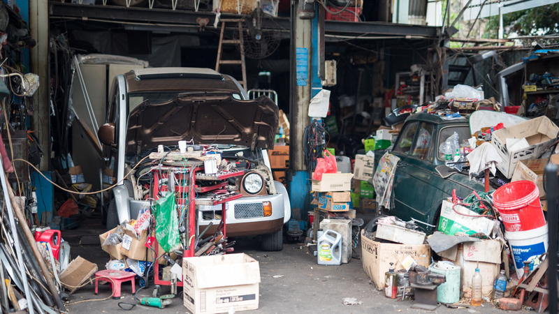 The man who worked at this garage disassembling Nissan Escargots was also the caretaker of the blue 240Z